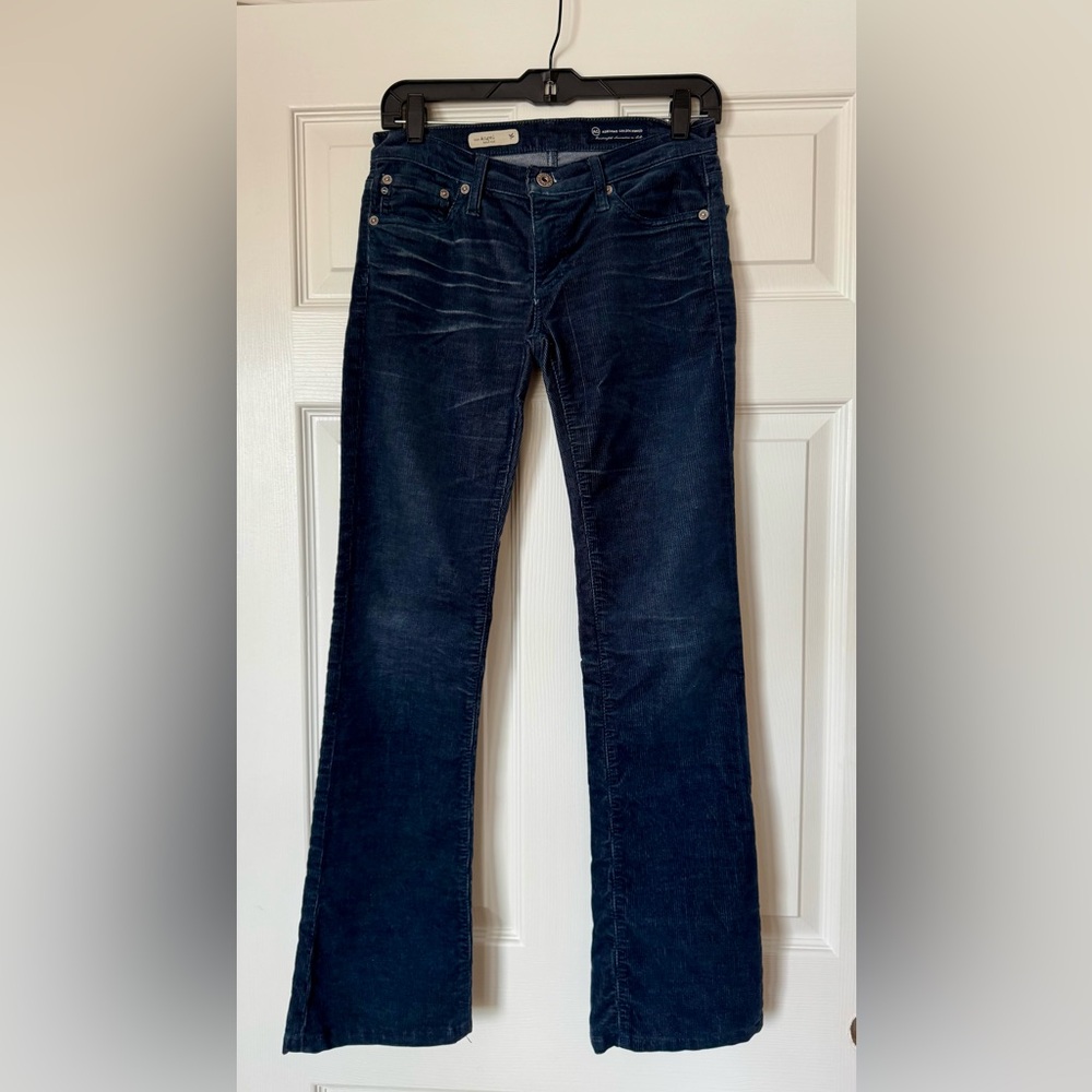 AG - Adriano Goldschmied boot cut low waisted blue corduroy jeans.
